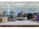 Well-stocked bar area with glass shelves and plenty of storage for glasses and liquor at 1562 Hawthorn Dr., Pawleys Island, SC 29585