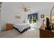 Bright bedroom with white walls, a ceiling fan and a sunlit window view at 1562 Hawthorn Dr., Pawleys Island, SC 29585