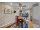Cozy dining area with wood table, ceiling fan, and sliding doors leading to the patio at 1562 Hawthorn Dr., Pawleys Island, SC 29585