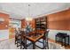 Elegant dining room with wood table, chandelier, and view into the adjacent kitchen at 1562 Hawthorn Dr., Pawleys Island, SC 29585