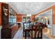 Formal dining room featuring a stylish chandelier, display cabinet, and beautiful decor at 1562 Hawthorn Dr., Pawleys Island, SC 29585