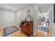 Inviting foyer with hardwood floors, a decorative dresser, and a view to the kitchen at 1562 Hawthorn Dr., Pawleys Island, SC 29585