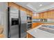 Spacious kitchen features stainless steel refrigerator and oven range at 1562 Hawthorn Dr., Pawleys Island, SC 29585