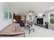 Spacious living room boasts a fireplace, ceiling fan, and comfortable leather furniture at 1562 Hawthorn Dr., Pawleys Island, SC 29585