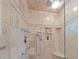 Luxurious shower with tile walls, built-in niche, rainfall shower head, and bench at 1562 Hawthorn Dr., Pawleys Island, SC 29585