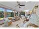 Relaxing sunroom featuring lake views, wicker furniture, and bright, airy atmosphere at 1562 Hawthorn Dr., Pawleys Island, SC 29585