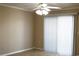 Neutral bedroom with ceiling fan and sliding glass door with vertical blinds at 3762 Citation Way # 1016, Myrtle Beach, SC 29577