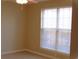 A well-lit bedroom features a large window with blinds and neutral-toned walls, creating a calming atmosphere at 3762 Citation Way # 1016, Myrtle Beach, SC 29577