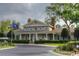 View of the clubhouse with a flagpole, landscaping and a row of arched windows at 3762 Citation Way # 1016, Myrtle Beach, SC 29577