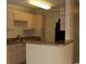 Kitchen view with breakfast bar, neutral cabinets, laminate countertops and black appliances at 3762 Citation Way # 1016, Myrtle Beach, SC 29577