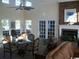 Cozy living room features large windows, a ceiling fan, and is furnished with a leather sofa and a decorative table at 3762 Citation Way # 1016, Myrtle Beach, SC 29577