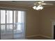 Living room view to the patio door features light walls and tile floors at 3762 Citation Way # 1016, Myrtle Beach, SC 29577