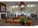 Spacious lounge area with a fireplace, comfortable seating, and expansive windows overlooking the pool at 3762 Citation Way # 1016, Myrtle Beach, SC 29577