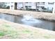 Pond with a fountain, landscaped banks and apartment buildings in the background at 3762 Citation Way # 1016, Myrtle Beach, SC 29577