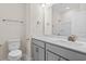 Neutral bathroom with gray vanity, white sink, and a towel rack at 5028 Cambria Ct., Little River, SC 29566