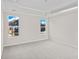 Spacious carpeted bedroom with two windows allowing plenty of sunlight at 5028 Cambria Ct., Little River, SC 29566