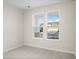 Bright bedroom view, illuminated by natural light filtering through a large double window at 5028 Cambria Ct., Little River, SC 29566