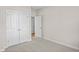 Empty room featuring plush carpet flooring, neutral wall paint, and a closet at 5028 Cambria Ct., Little River, SC 29566
