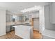 Modern kitchen with stainless steel appliances, a central island, and elegant gray cabinetry at 5028 Cambria Ct., Little River, SC 29566
