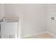 Laundry room with large utility sink, white walls, and tile flooring at 5028 Cambria Ct., Little River, SC 29566