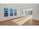 Spacious living room filled with natural light, featuring hardwood floors and an open layout at 5028 Cambria Ct., Little River, SC 29566