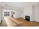 Inviting living room with a cozy fireplace, hardwood floors, and an open floor plan at 5028 Cambria Ct., Little River, SC 29566