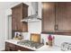 Modern kitchen with stainless steel range hood and white backsplash at 1054 Graybill Lane, North Myrtle Beach, SC 29582