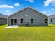 Green backyard with lawn and patio, perfect for outdoor enjoyment and entertaining at 1126 Cherrystone Loop, Conway, SC 29526
