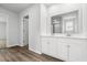 Bathroom with a double sink vanity and a view of the enclosed shower in the mirror at 1126 Cherrystone Loop, Conway, SC 29526