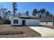 Charming one-story home featuring white siding, black shutters, and a well-manicured lawn at 1126 Cherrystone Loop, Conway, SC 29526
