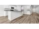 New kitchen features stainless steel appliances, granite counters, and white cabinets at 1126 Cherrystone Loop, Conway, SC 29526