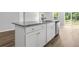 Kitchen island features granite countertop, white cabinets, and stainless steel dishwasher at 1126 Cherrystone Loop, Conway, SC 29526