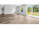 Bright and airy living room with luxury vinyl floors and sliding door access to back yard at 1126 Cherrystone Loop, Conway, SC 29526