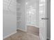 Spacious walk-in closet with wire shelving, providing ample storage space and access to the en-suite bathroom at 1126 Cherrystone Loop, Conway, SC 29526