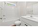 Clean, white bathroom features a combined shower and tub, white cabinets, and a coordinating toilet at 2612 Old Charleston Rd., Georgetown, SC 29440