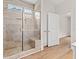 Bathroom with walk-in tiled shower featuring a glass door and built-in bench seating at 2612 Old Charleston Rd., Georgetown, SC 29440