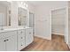 Bathroom featuring a double sink vanity, walk in shower, and wood-look flooring at 2612 Old Charleston Rd., Georgetown, SC 29440
