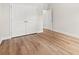 Bedroom featuring hard wood floors, neutral colors, and a closet with bright white double doors at 2612 Old Charleston Rd., Georgetown, SC 29440