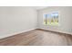 Bright bedroom with hardwood floors, ample natural light from the large window, and neutral walls at 2612 Old Charleston Rd., Georgetown, SC 29440
