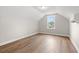 Bedroom with wood-look flooring and a window offering a view of the neighborhood at 2612 Old Charleston Rd., Georgetown, SC 29440