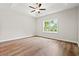 Bright bedroom with wood-look floors and a large window offering a pleasant view at 2612 Old Charleston Rd., Georgetown, SC 29440