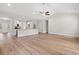 Bright, open-concept living area with wood-look flooring and vaulted ceilings at 2612 Old Charleston Rd., Georgetown, SC 29440