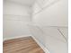 Walk-in closet with wood-look flooring and wire shelving for ample storage at 2612 Old Charleston Rd., Georgetown, SC 29440