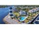Aerial view of waterfront community with lighthouse, pool, and marina at 4633 Lightkeepers Way # 5-J, Little River, SC 29566