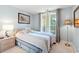 Condo bedroom with coastal decor and large windows at 4633 Lightkeepers Way # 5-J, Little River, SC 29566