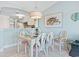 Bright dining area with table, chairs, and kitchen view at 4633 Lightkeepers Way # 5-J, Little River, SC 29566