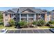 Condo building exterior with landscaping and parking at 4633 Lightkeepers Way # 5-J, Little River, SC 29566