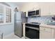 Condo kitchen with stainless steel appliances at 4633 Lightkeepers Way # 5-J, Little River, SC 29566