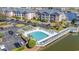 Community pool with surrounding deck and waterfront access at 4633 Lightkeepers Way # 5-J, Little River, SC 29566