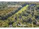 Aerial view of 89 Gleneagle Ln. nestled in lush trees, near the Heritage Plantation Golf Course at 89 Gleneagle Ln., Pawleys Island, SC 29585
